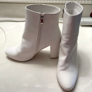 White Heels. Marked as 8. US size 10.